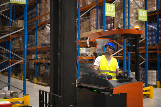forklift-driver-relocating-lifting-goods-large-warehouse-center